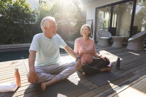 Senior Couple Enjoying Yoga in Tranquil Outdoor Setting