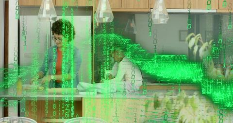 Curly woman and partner preparing meal at kitchen island with green binary glitch effect