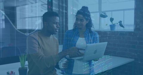 Colleagues Collaborating with Digital Data Overlay in Modern Tech Office