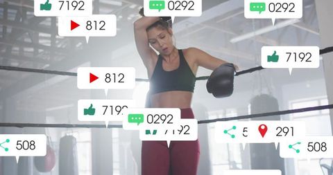 Leaning female boxer catching breath in ring with social media engagement bubbles overlay
