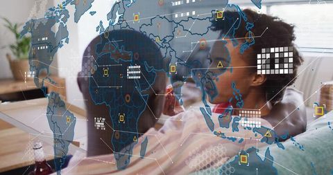 Couple Relaxing with Snack in Living Room with Digital Map Overlay