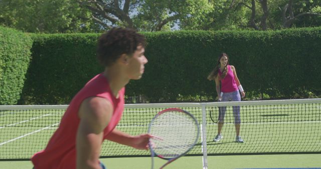 Friends Enjoying Outdoor Tennis Match on Sunny Day - Download Free Stock Images Pikwizard.com