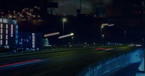 Night Cityscape with Fast Motion Traffic and Light Trails