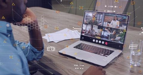 Businessman Watching Remote Team Video Conference on Laptop with Digital HUD Overlay