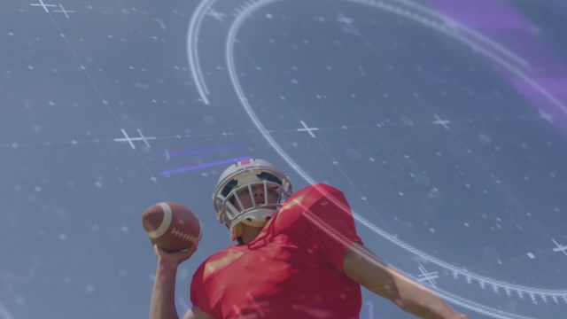 The scene features an American football player throwing a football, outfitted in a red uniform and helmet, set against a backdrop of digital holograms and technological interfaces. This video is ideal for use in sports marketing, technology in sports innovations, and futuristic-themed campaigns. The dynamic action combined with the tech overlay suggests advancements and progress in athletic performance monitoring.