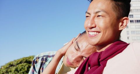Happy Couple Relaxing in Sunlit Outdoor Area