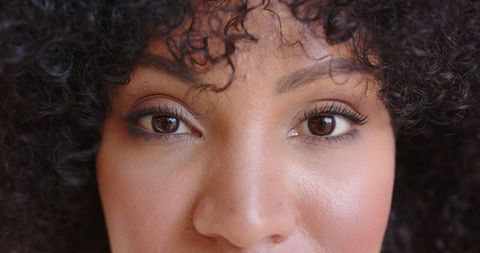 Close-up portrait highlighting eyes and makeup elegance