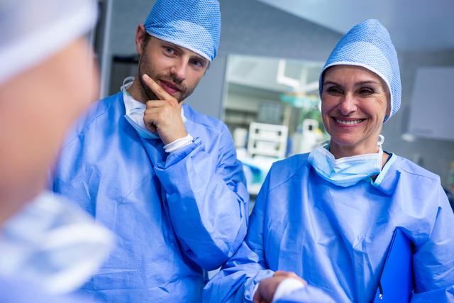 Surgeons Interacting in Hospital Operating Room - Download Free Stock Images Pikwizard.com