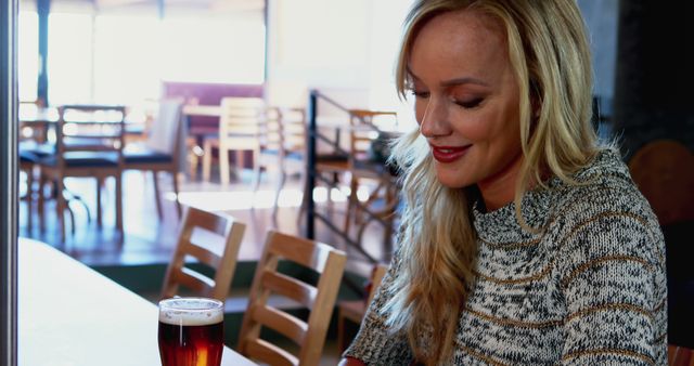 Woman Smiling in Restaurant with a Drink - Download Free Stock Images Pikwizard.com