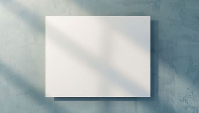 Blank Canvas on Textured Wall with Sunlight Shadows