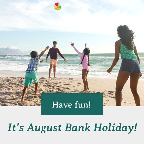 Family Playing on Beach During August Bank Holiday Celebrations