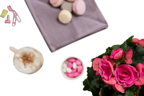 Transparent elegant table spread with macarons and flowers