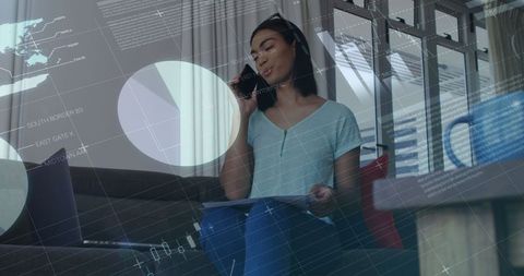 Woman Analyzing Financial Data with Laptop and Phone