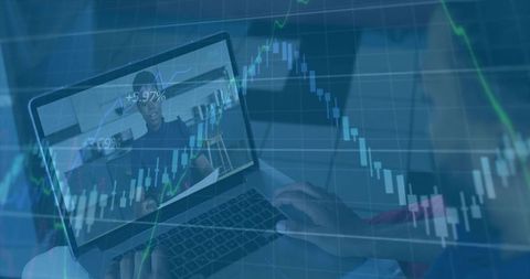 Typing laptop monitoring candlestick charts during remote collaboration video call