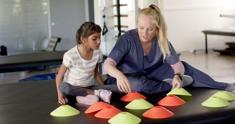 Physical Therapy Session with Child and Therapist Engaged in Rehabilitation