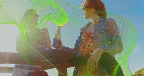 Friends Enjoying Drinks by Ocean with Vibrant Effects