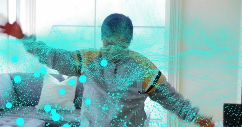 Senior woman stretching arms at sunlit bedroom window with turquoise particle overlay