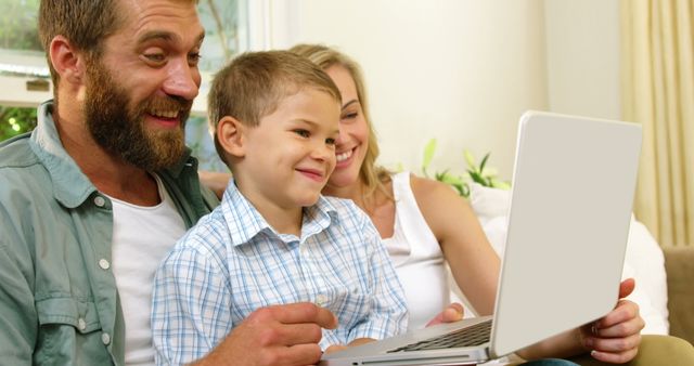 Happy Family Video Calling on Laptop in Living Room - Download Free Stock Images Pikwizard.com