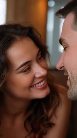 Couple Sharing Intimate Smile Leaning Close on Couch in Cozy Lounge Vertical Video