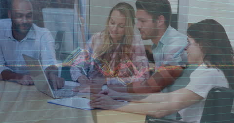 Diverse Business Team Analyzing Economic Data in Office