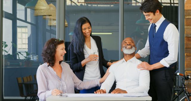 Diverse Team Sharing Light Moments in Modern Office - Download Free Stock Images Pikwizard.com