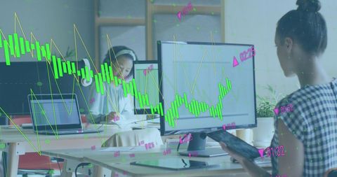 Diverse Team Analyzing Financial Data at Modern Office