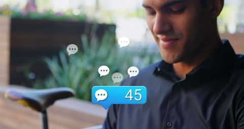 Man Connecting via Smartwatch Outdoors with Social Media Icons