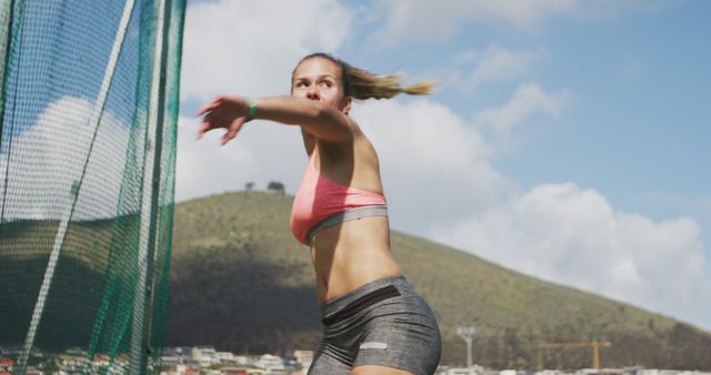 Female Athlete Throwing Discus in Outdoor Competition - Download Free Stock Images Pikwizard.com