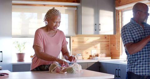 Senior Couple Sharing Happy Moments in Bright Kitchen