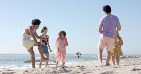 Beach Soccer Fun with Energetic Group of Friends Enjoying the Sunshine - Download Free Stock Images Pikwizard.com
