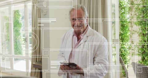 Senior Doctor Holding Tablet in Sunlit Home Office with Digital Health Interface