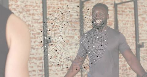Singer rehearsing and smiling in studio with female shoulder foreground and digital sound grid overl