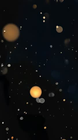 Fading Warm Orb Descending Dark Void Guiding Bokeh Particles | Vertical Abstract Video