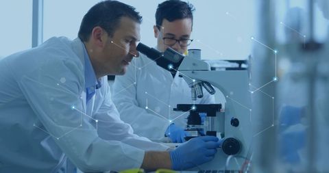 Scientists in Laboratory Exploring Global Data Connections Using Microscopes - Download Free Stock Images Pikwizard.com