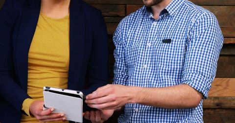 Colleagues Collaborating with Tablet in Modern Office - Download Free Stock Images Pikwizard.com