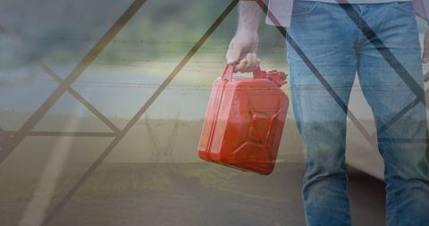 Man Holding Red Gas Canister in Futuristic Energy Setting