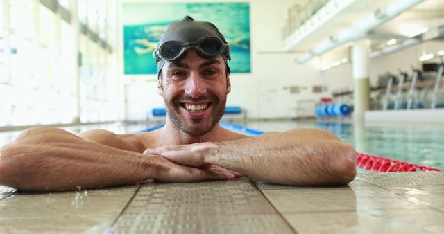 Smiling Male Swimmer Relaxing at Edge of Swimming Pool - Download Free Stock Images Pikwizard.com