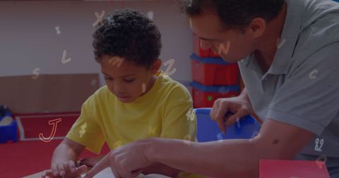 Teacher Mentoring Young Student in Learning Activity