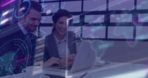 Colleagues Analyzing Data on Laptop with Digital Chart Overlay