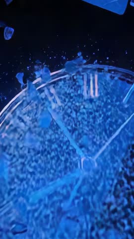 Vertical Cinematic Video of Cracking Glass Clock Shattering Roman Numerals in Dark Void
