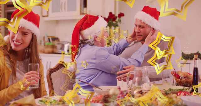 Lively Christmas Dinner with Family Wearing Santa Hats - Download Free Stock Images Pikwizard.com