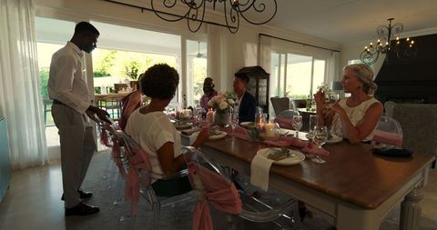 Elegant dining table prepared for wedding celebration guests indoors