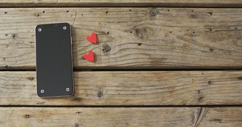 Smartphone and Wooden Hearts on Rustic Wood Background - Download Free Stock Images Pikwizard.com