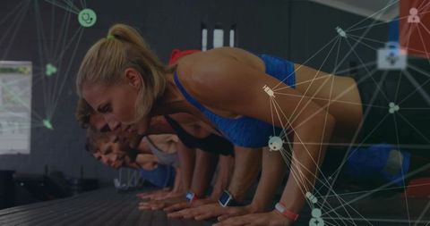 Group holding plank with fitness trackers and network overlay showcasing wearable tech