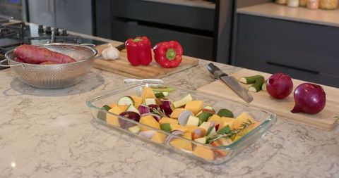 Fresh Veggies Prepared for Baking on Marble Countertop