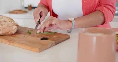 Preparing Fresh Herbs in Modern Home Kitchen