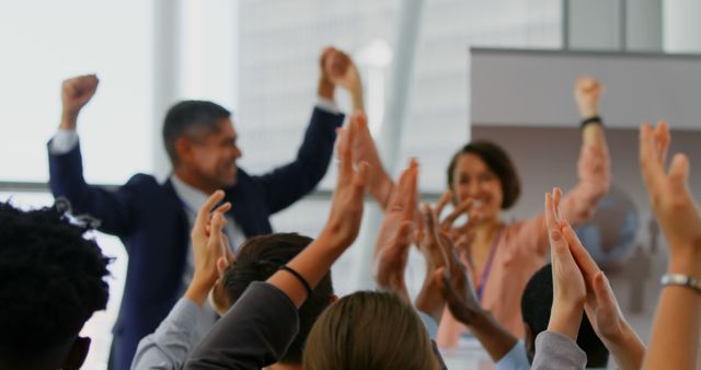 Business professionals celebrate after a successful presentation in a modern office. Ideal for illustrating corporate success, motivation, team achievement, and positivity in business contexts.