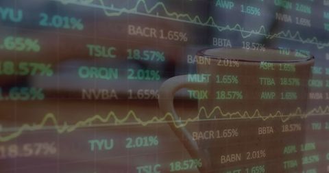 Laptop usage with real-time financial data overlay