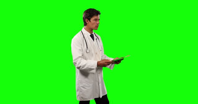 Male Doctor With Stethoscope Holding Medical Documents Against Green Screen - Download Free Stock Images Pikwizard.com
