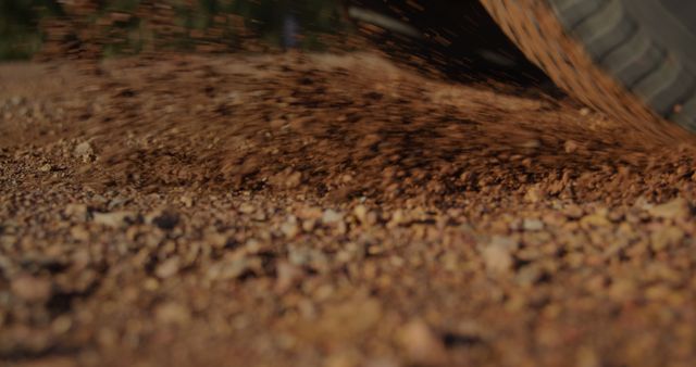 Car Tire Kicking Up Dust and Gravel on Dirt Road - Download Free Stock Images Pikwizard.com